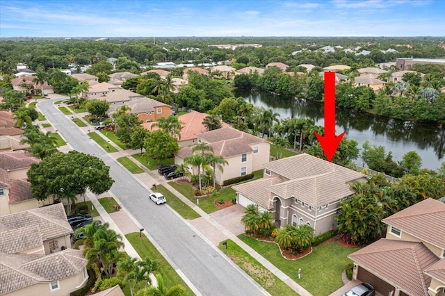 birds eye view of property featuring a water view