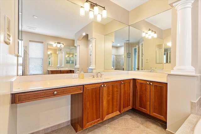 bathroom with vanity, a shower with door, and tile patterned flooring