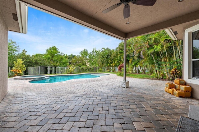 view of swimming pool featuring a patio area, ceiling fan, and an in ground hot tub