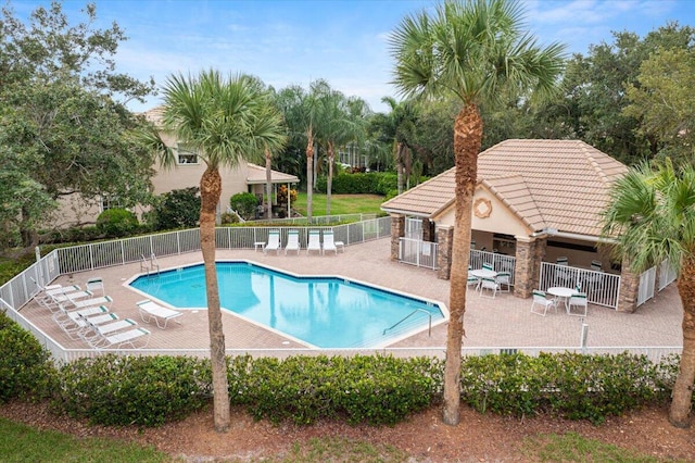 view of swimming pool featuring a patio area