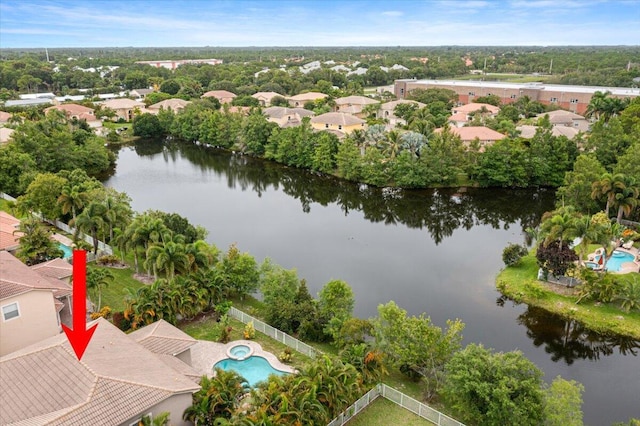 birds eye view of property with a water view