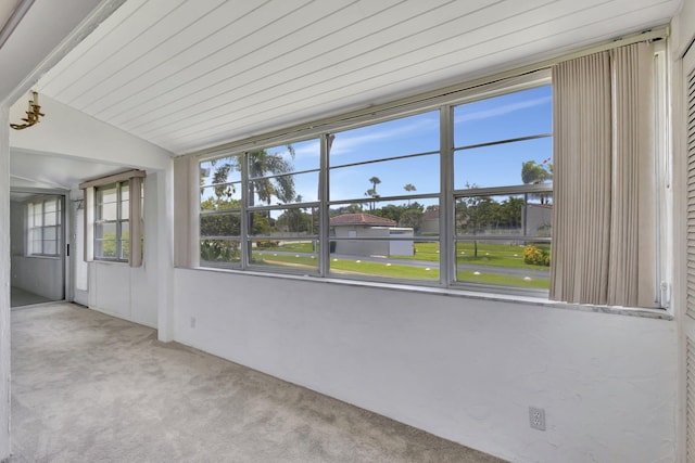 unfurnished sunroom with vaulted ceiling