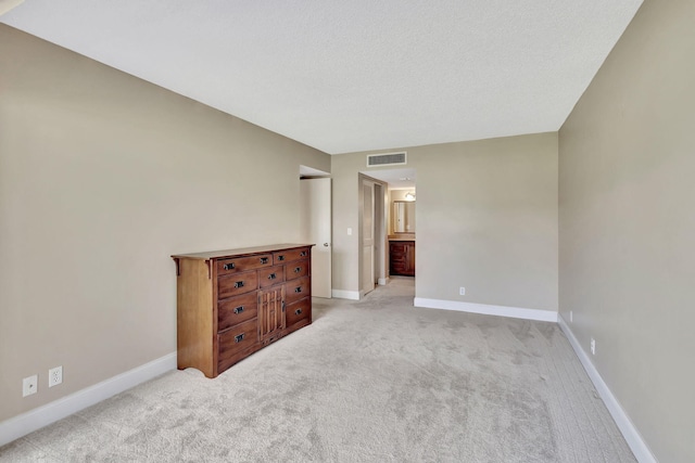 spare room with light colored carpet