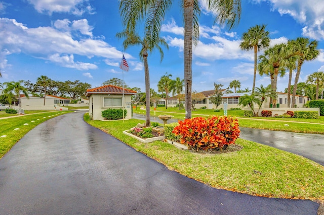 mediterranean / spanish-style house featuring a front lawn