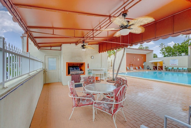 view of swimming pool with ceiling fan