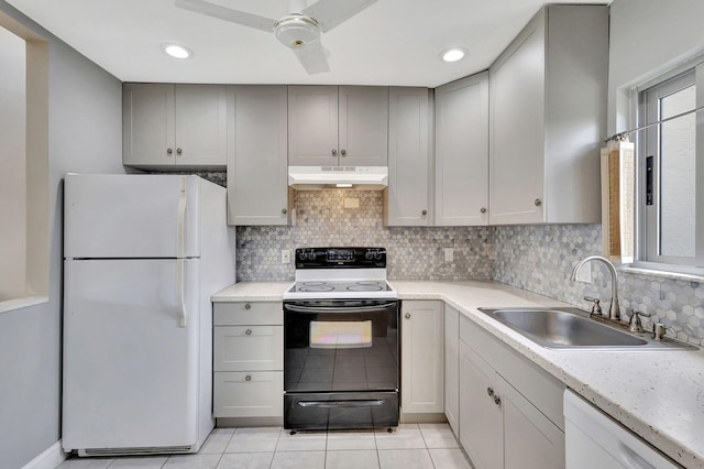 kitchen with white appliances, ceiling fan, sink, light tile patterned floors, and gray cabinets