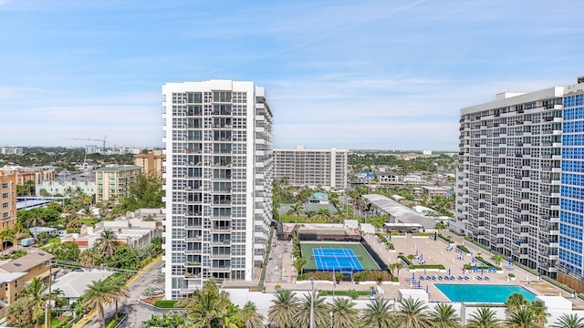 view of building exterior featuring a community pool