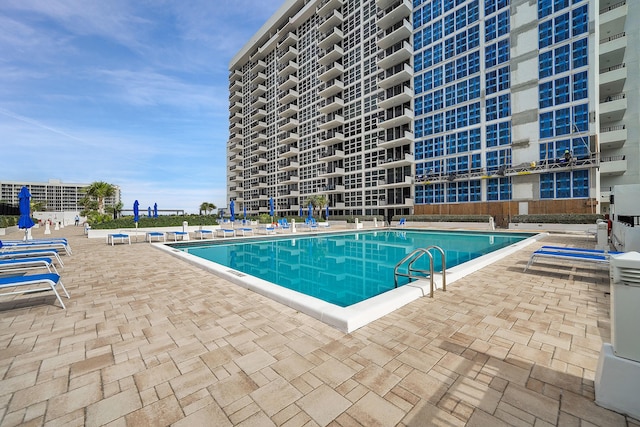 view of pool featuring a patio area