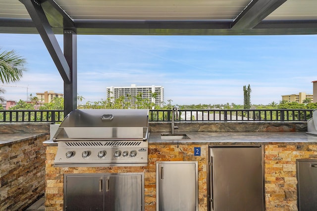 view of patio / terrace with area for grilling and sink