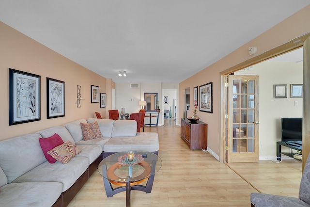 living room with light hardwood / wood-style floors