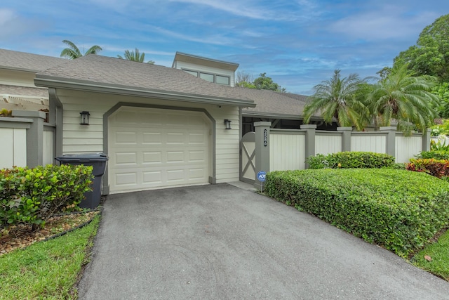 single story home featuring a garage