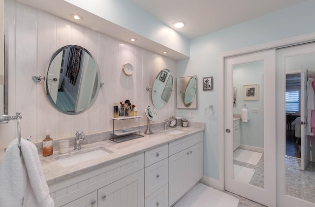 bathroom with tile patterned floors and vanity