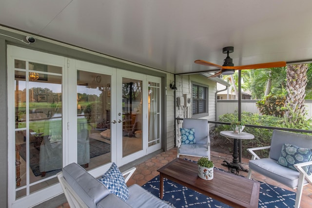 sunroom / solarium with french doors and ceiling fan