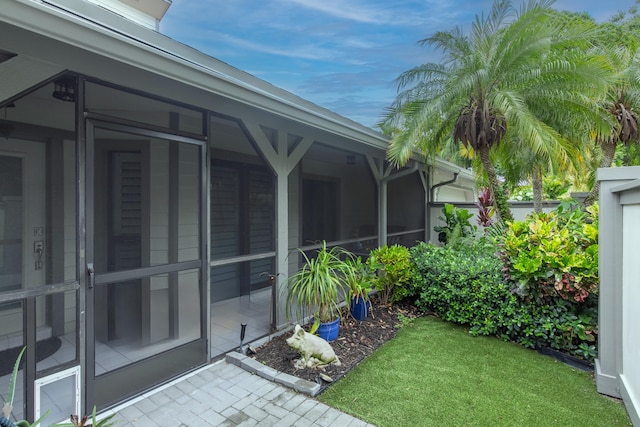 view of yard featuring a sunroom