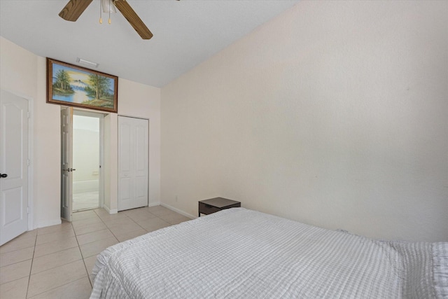 tiled bedroom with ceiling fan