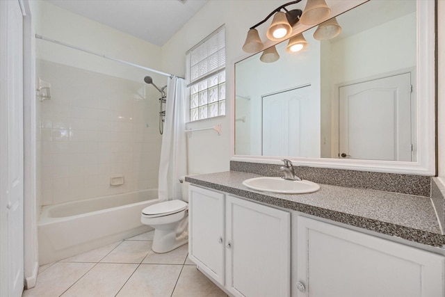 full bathroom featuring toilet, vanity, tile patterned flooring, and shower / tub combo