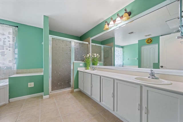 bathroom featuring shower with separate bathtub, double sink vanity, and tile patterned flooring