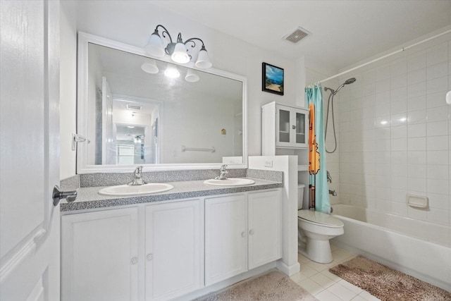 full bathroom with tile patterned flooring, dual bowl vanity, toilet, and shower / tub combo with curtain