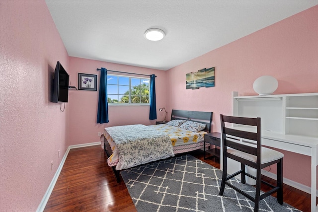 bedroom featuring dark wood-type flooring