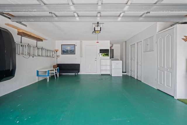 garage with washer / dryer and a garage door opener