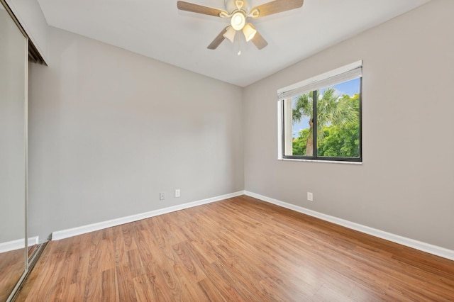 spare room featuring ceiling fan and light hardwood / wood-style floors