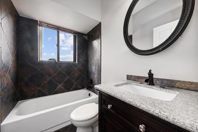 full bathroom featuring toilet, vanity, tile patterned flooring, and tiled shower / bath combo