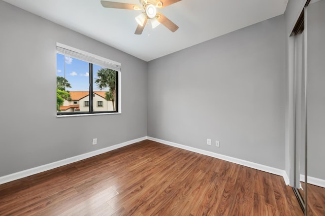 unfurnished room featuring ceiling fan and wood-type flooring