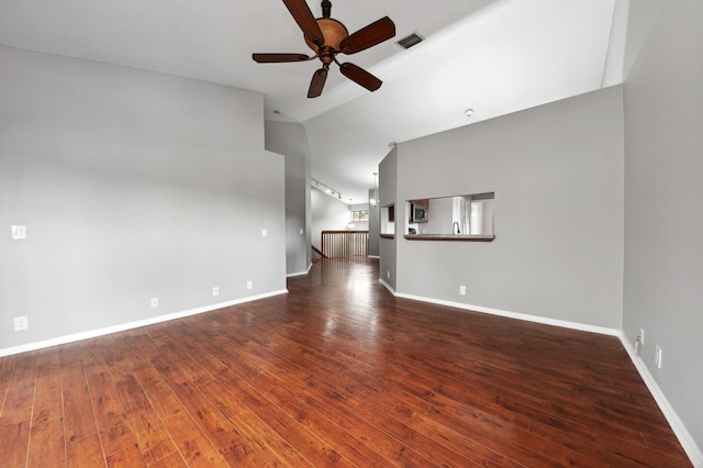 unfurnished living room with lofted ceiling, ceiling fan, and dark hardwood / wood-style flooring