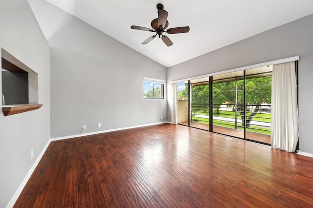 spare room featuring ceiling fan, hardwood / wood-style floors, high vaulted ceiling, and a healthy amount of sunlight