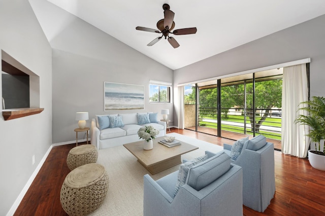 living room featuring dark wood-type flooring, ceiling fan, and high vaulted ceiling