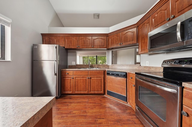 kitchen featuring sink, dark hardwood / wood-style flooring, and stainless steel appliances