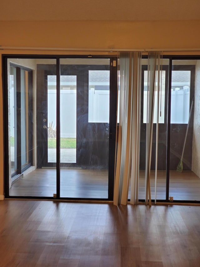 doorway to outside featuring hardwood / wood-style flooring