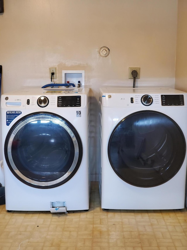 laundry area with washer and clothes dryer