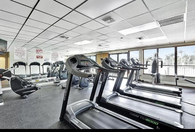 workout area featuring a paneled ceiling