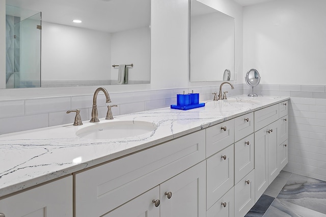 bathroom featuring tile walls and vanity