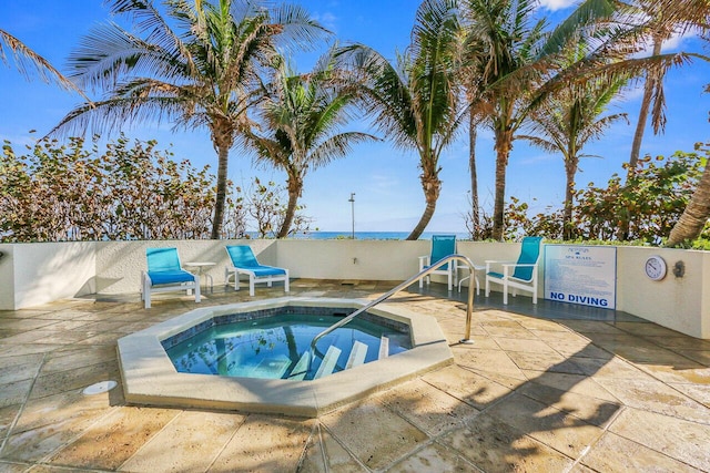 view of pool with a patio and a community hot tub