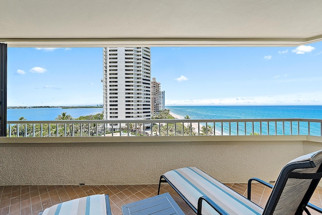 balcony featuring a water view