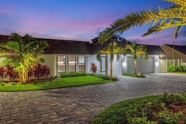 view of front of property with a garage