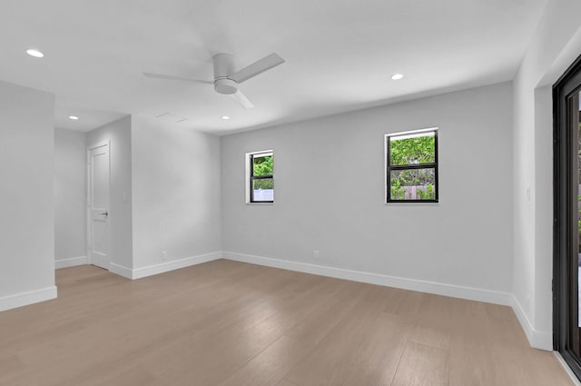 empty room featuring light hardwood / wood-style flooring and ceiling fan