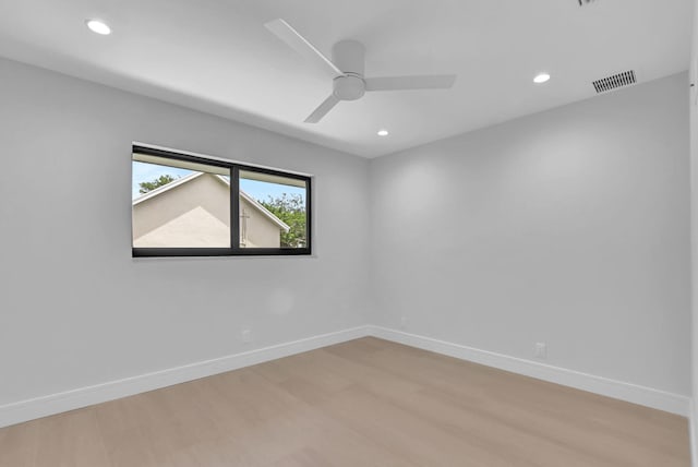 unfurnished room with light wood-type flooring and ceiling fan