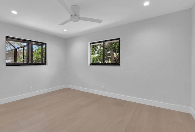 unfurnished room with ceiling fan and light hardwood / wood-style flooring