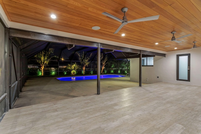 view of patio / terrace featuring a lanai and ceiling fan