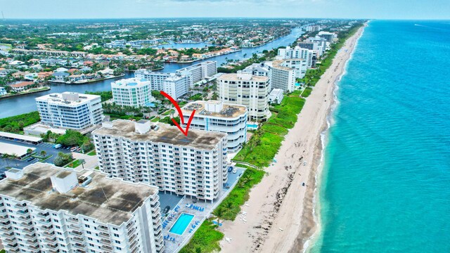 bird's eye view featuring a view of the beach and a water view