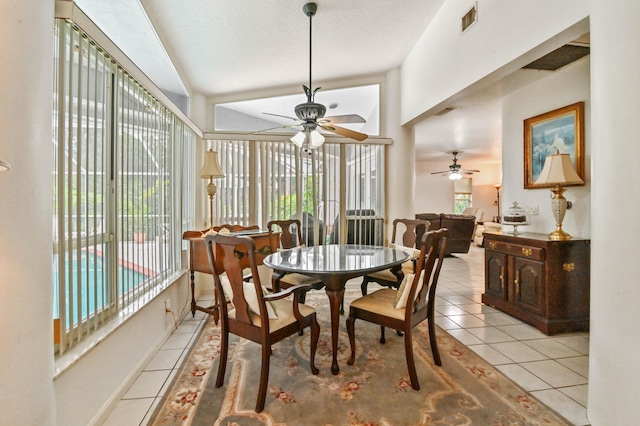 dining room with ceiling fan and light tile patterned floors