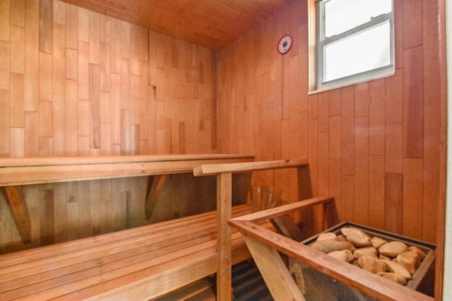 view of sauna / steam room featuring wood walls