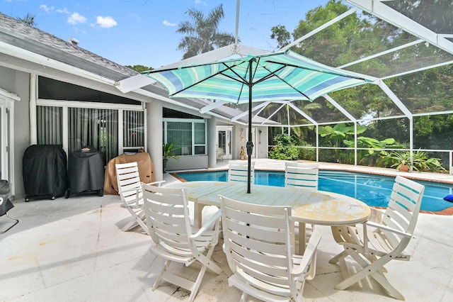 view of pool with a patio area and a lanai