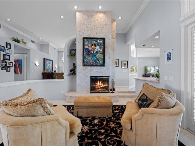 tiled living room featuring a fireplace and crown molding