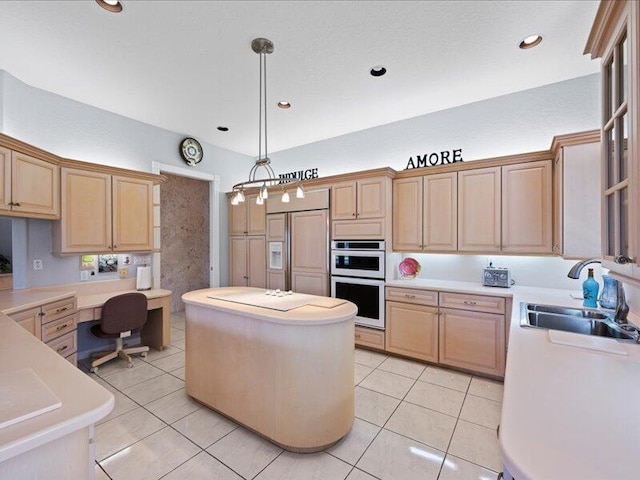 kitchen featuring built in desk, white appliances, hanging light fixtures, sink, and light tile patterned flooring