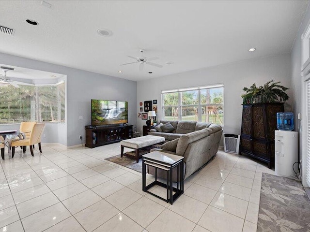 tiled living room featuring ceiling fan