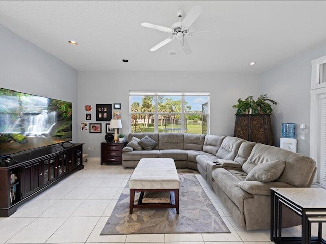 tiled living room featuring ceiling fan